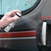 virusend travel spray on a handle of the car